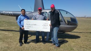 Saskarc presents check to Stars